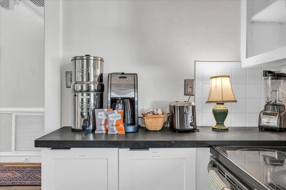 Kitchen: Brew your morning magic with our stylish coffee station and delightful treats!