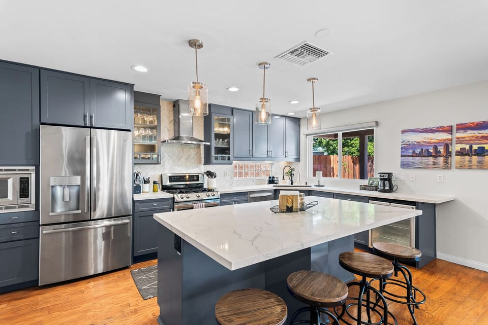 Enjoy effortless entertaining with a complete kitchen and inviting bar seating area.
