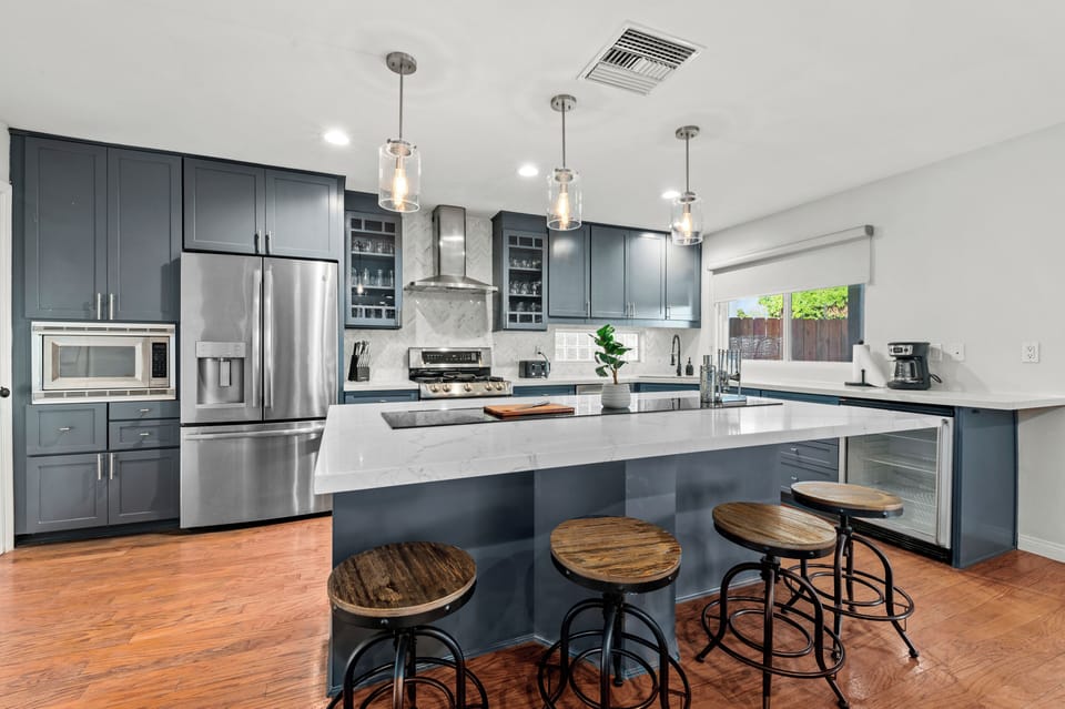 Enjoy effortless entertaining with a complete kitchen and inviting bar seating area.