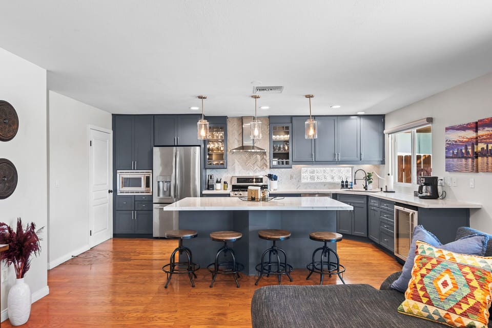Enjoy effortless entertaining with a complete kitchen and inviting bar seating area.
