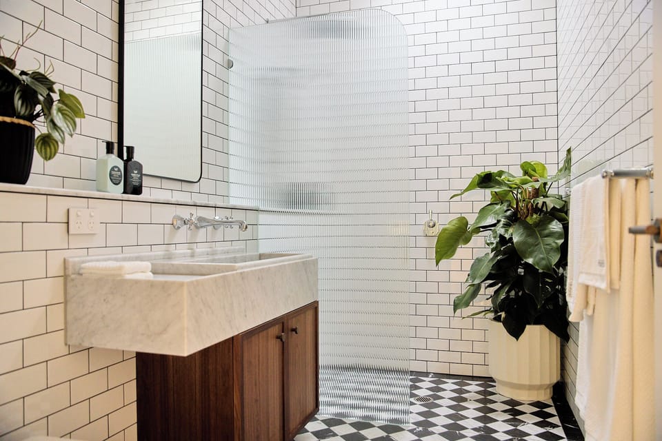 Large bathroom with natural light, Leif Products and Sheridan towels (1)