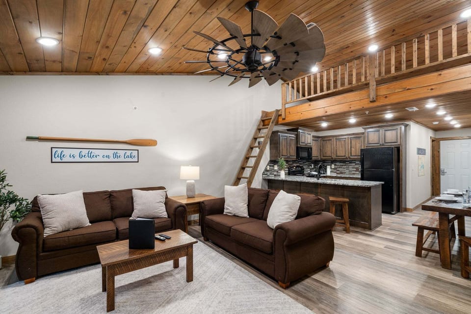 Living Room with Cable TV, Fireplace, Various Board Games, Sleeper Sofa, Loft, and Deck Access