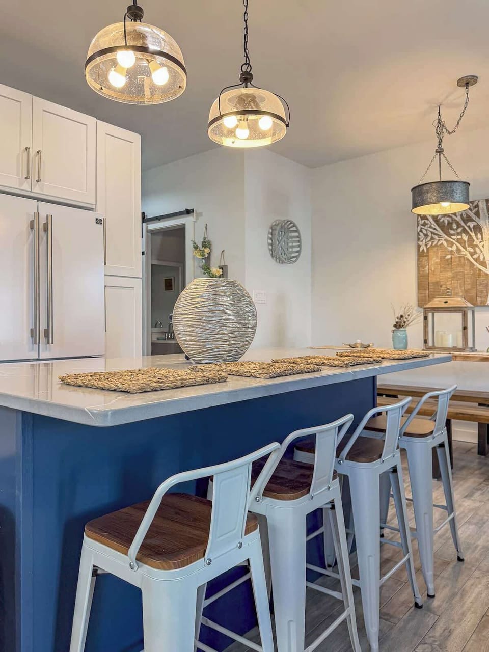 Barstool seating for 4 at the kitchen island supplements dining seating and is a great spot for breakfast, a quick snack, or enjoying a beverage.