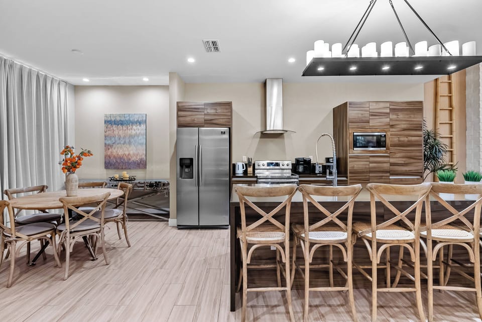 Enjoy the inviting atmosphere of this stylish kitchen and dining area, complete with natural wood textures and modern appliances.