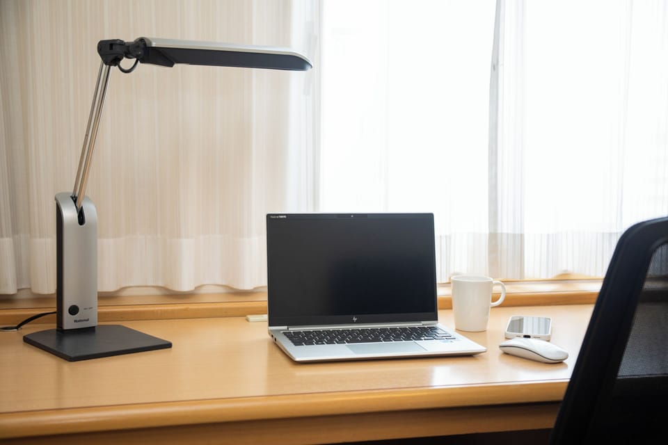 Down comforters, desk, laptop workspace, blackout drapes