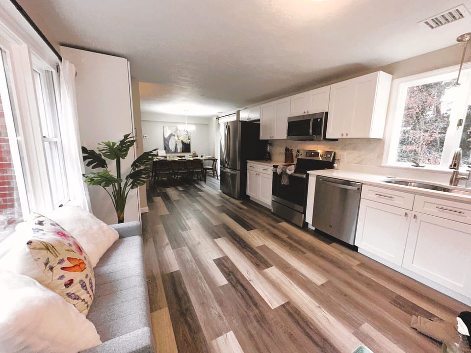 Large kitchen on first level has seating to hang out with the chef!
