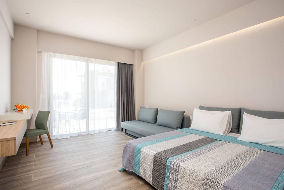Family Quadruple Room, Garden View | In-room safe, desk, soundproofing, free cribs/infant beds