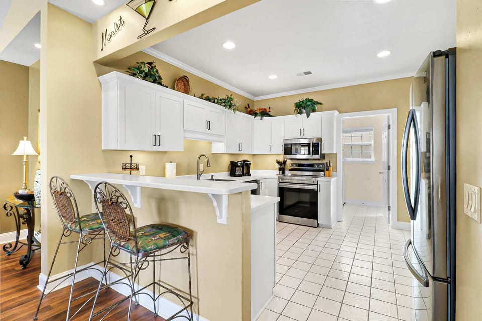 Kitchen is fully stocked with all the cookware and dishware needed!