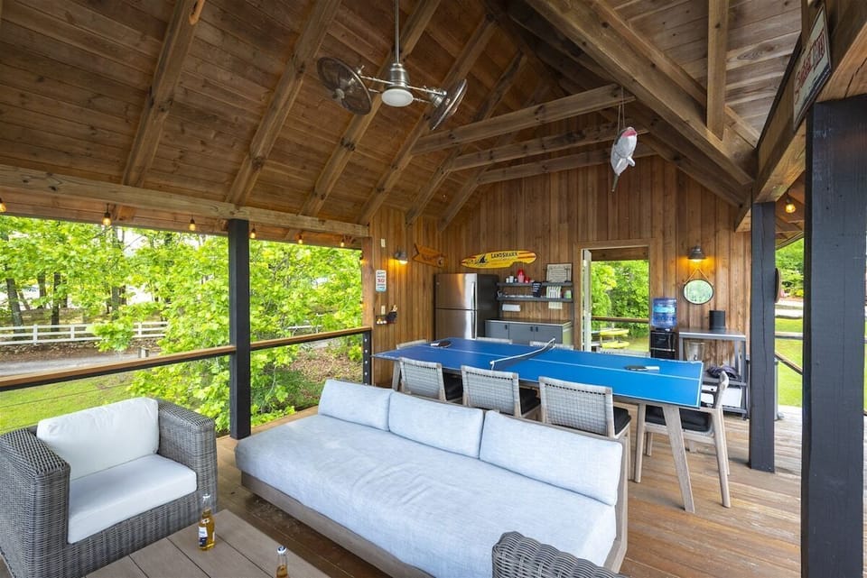 Outdoor living and entertaining space in boathouse