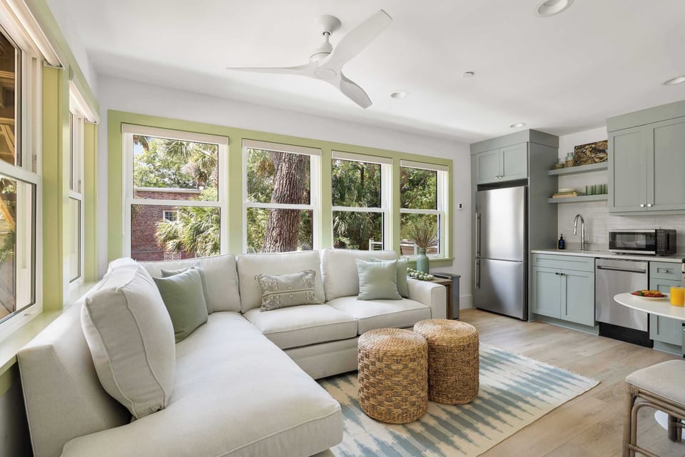 Open layout spacious living room with seating for your entire group + kitchen!