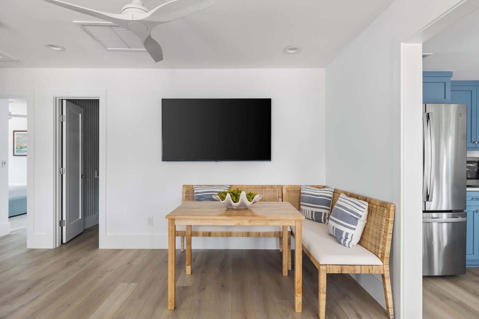 Dining seating for four guests + TV