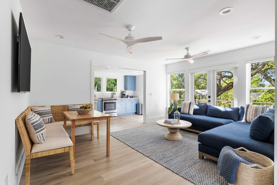 Spacious living room with seating for your entire group + TV and dining seating for four guests