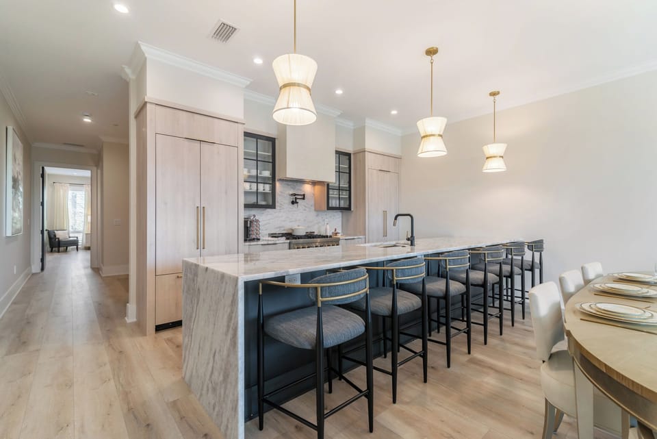 Sleek and modern kitchen with oversized island with seating for 6