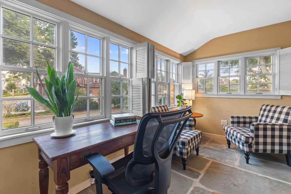 Quiet office space with desk, chair, sitting area, and high-speed WiFi