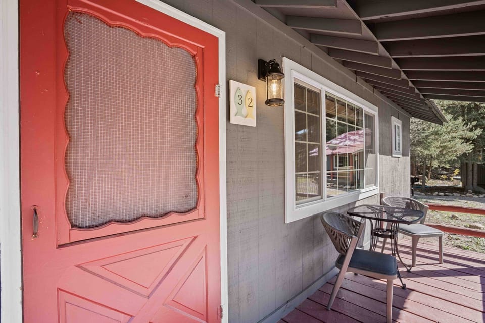 Sip morning coffee by the door in crisp mountain air.