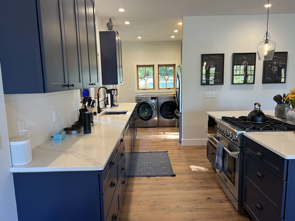 View through the kitchen to the laundry room (soap and dryer sheets provided)