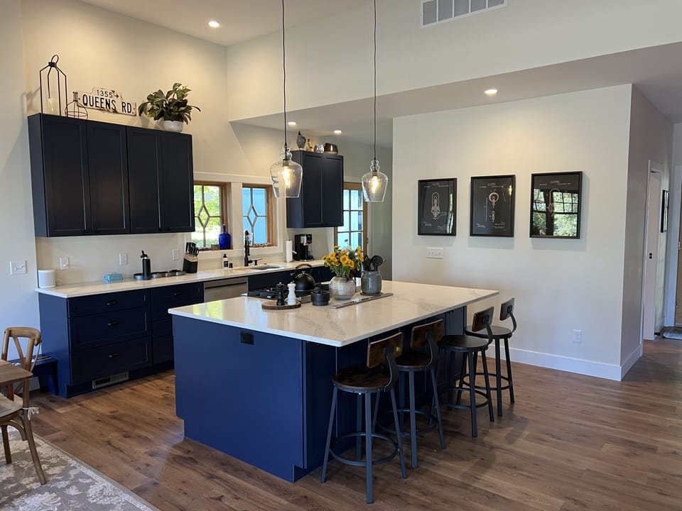 Large kitchen with island, gas stove, and dishwasher
