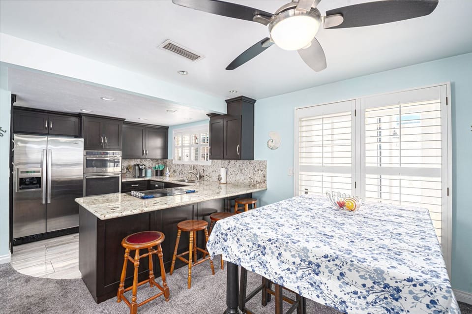 Seamless dining and kitchen space designed for effortless, elevated coastal living
                