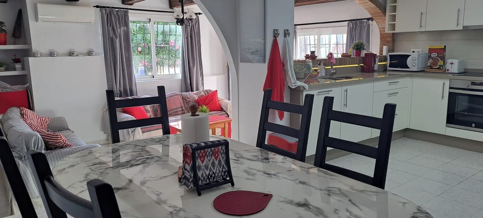 Open plan living with a fully fitted kitchen which has a hob, oven, dishwasher, fridge/freezer and all the utensils that you would need to make use of, if you wish to cook in some days.