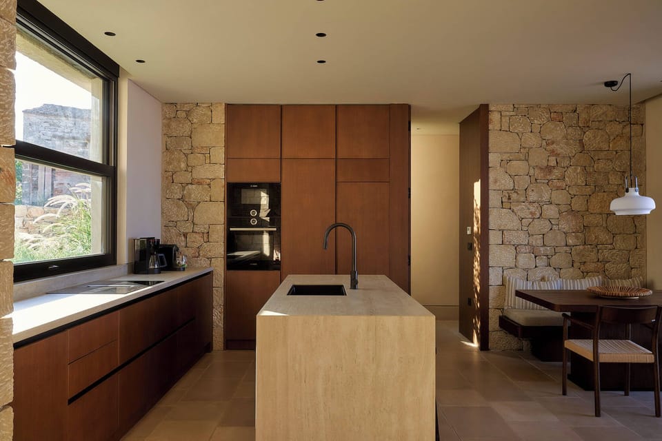 A sun-filled kitchen with dining area and island for ultimate comfort.