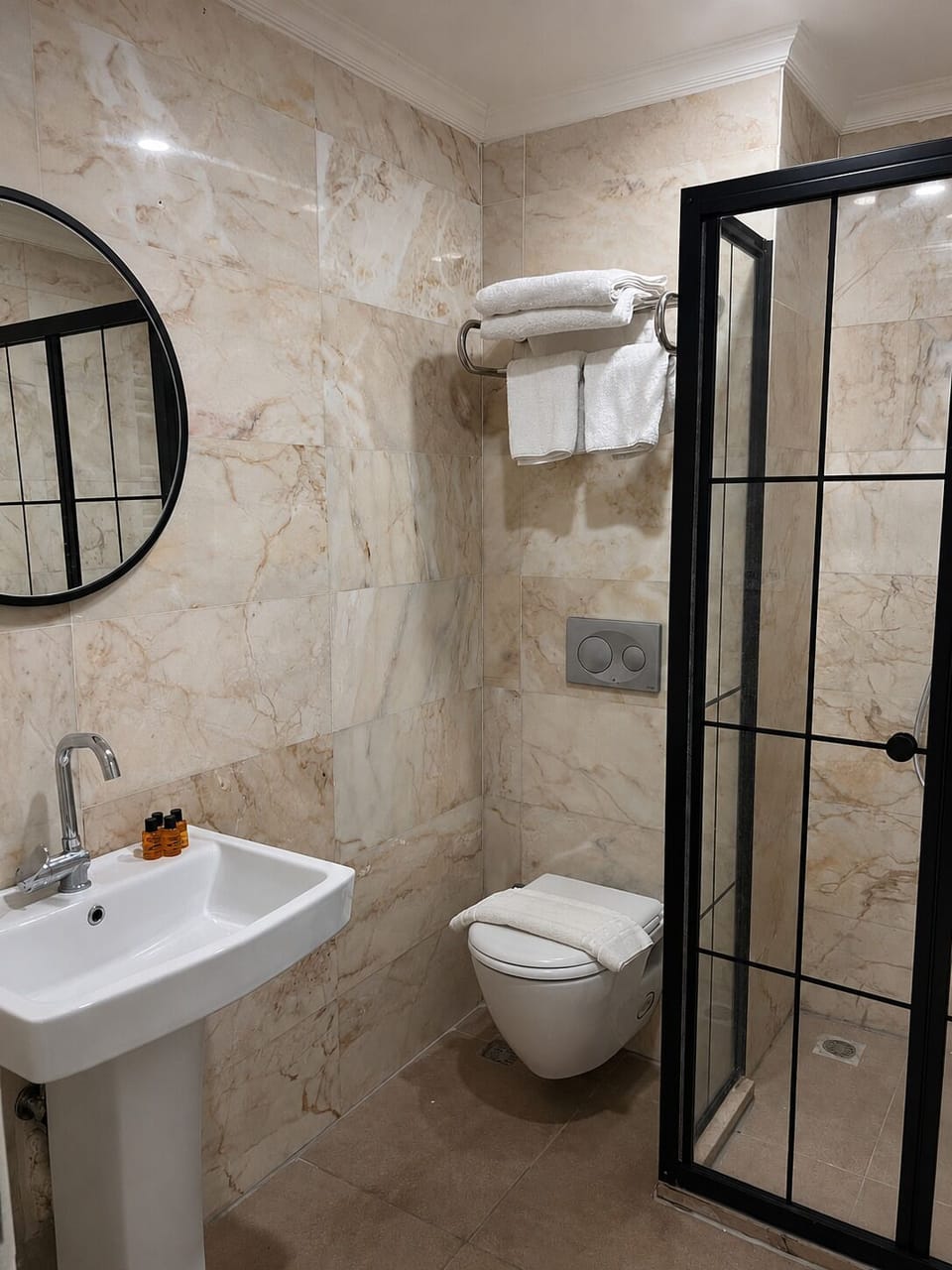 Shower, hair dryer, slippers, towels