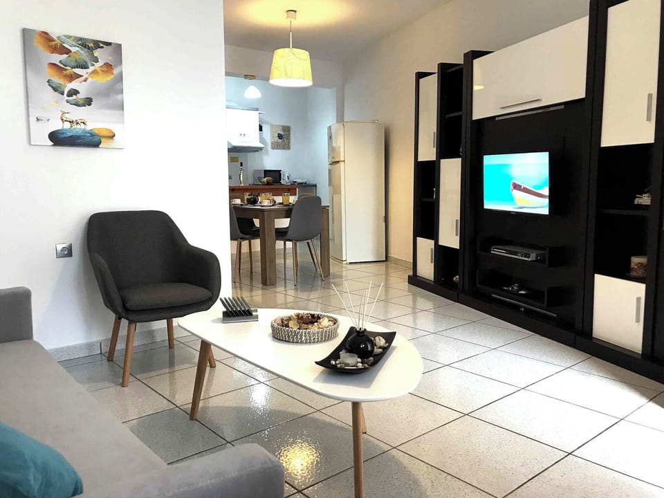 Basic Apartment, Sea View | Living area | Flat-screen TV