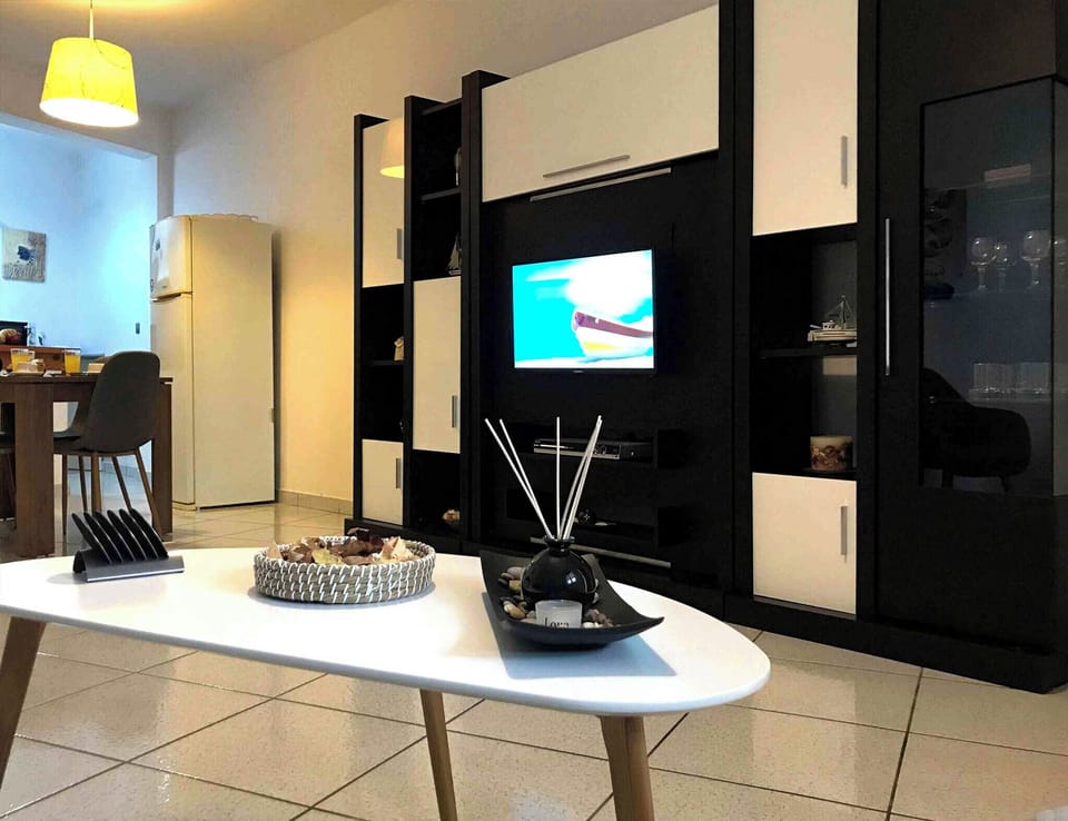 Basic Apartment, Sea View | Living area | Flat-screen TV