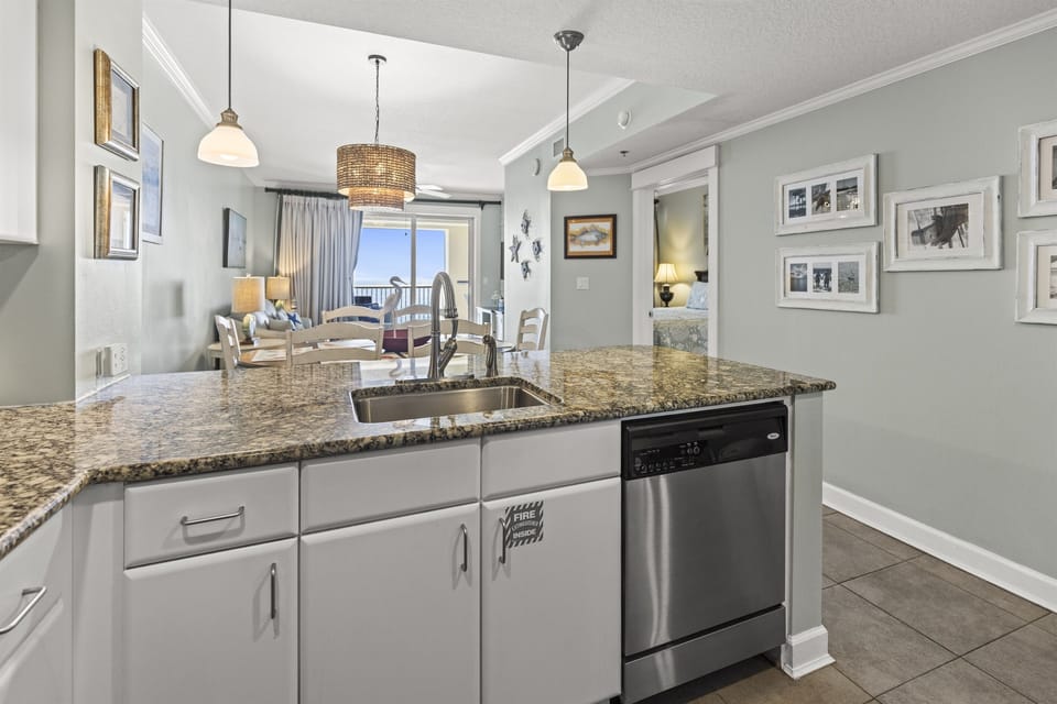 Cook with ease at your granite island while natural light streams through to the dining area beyond.