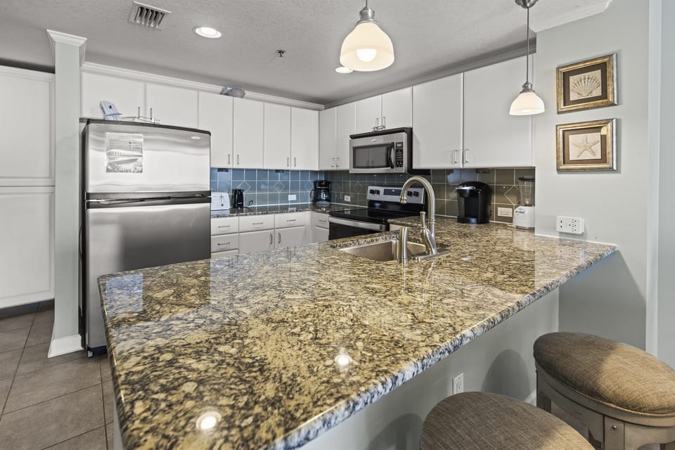 Your fully-equipped kitchen features granite countertops and stainless steel appliances, perfect for preparing meals during your stay.