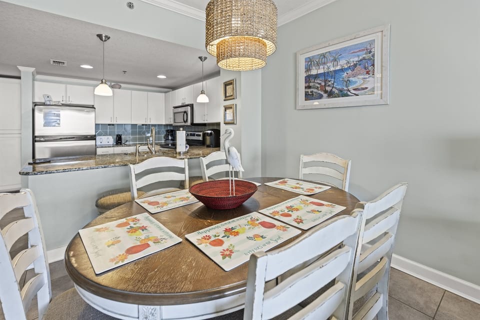 Gather around your welcoming dining table where shared meals become cherished memories, with a fully equipped kitchen ready for your culinary adventures.