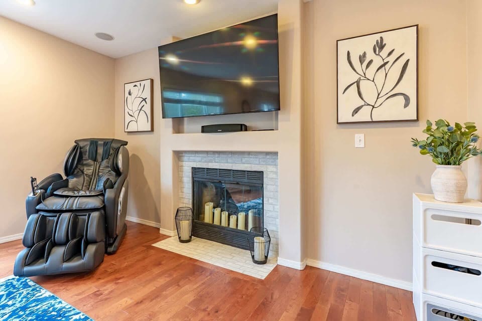 A massage chair in the cozy family room, offering comfort and stress relief.