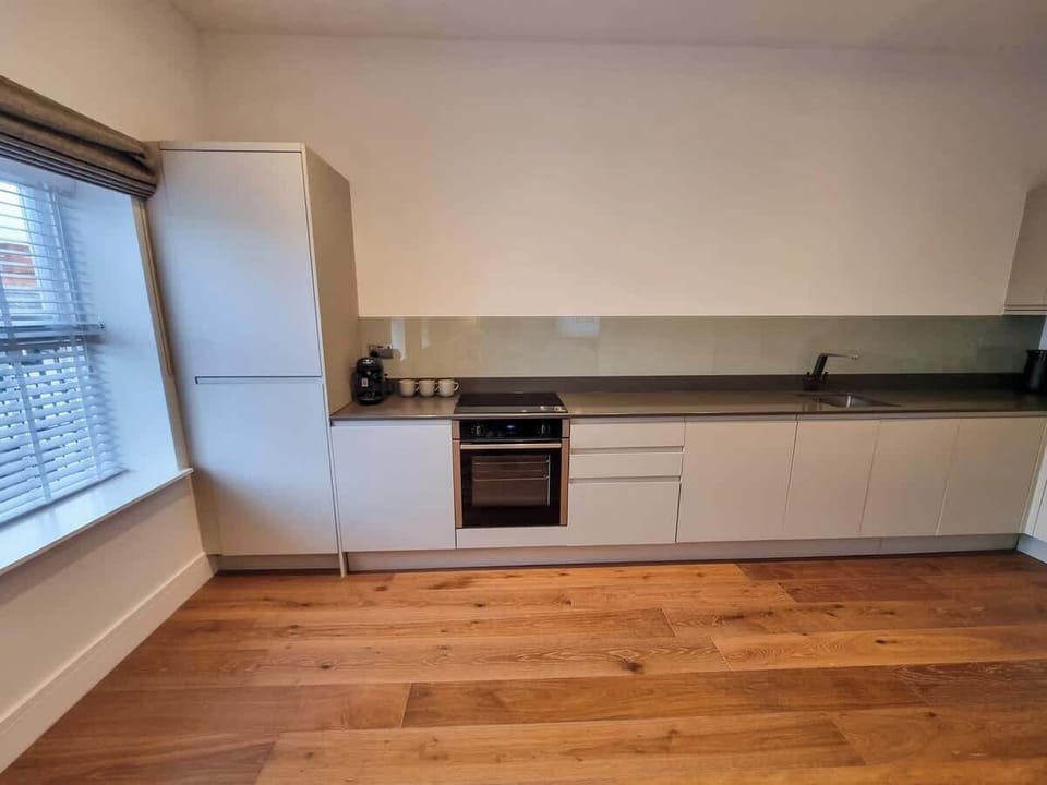 The open-plan layout connects kitchen, dining and living so everyone stays together