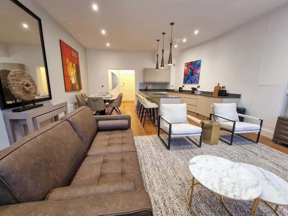 The open-plan living space flows from kitchen to dining to lounge, giving your group plenty of room to spread out and feel at home