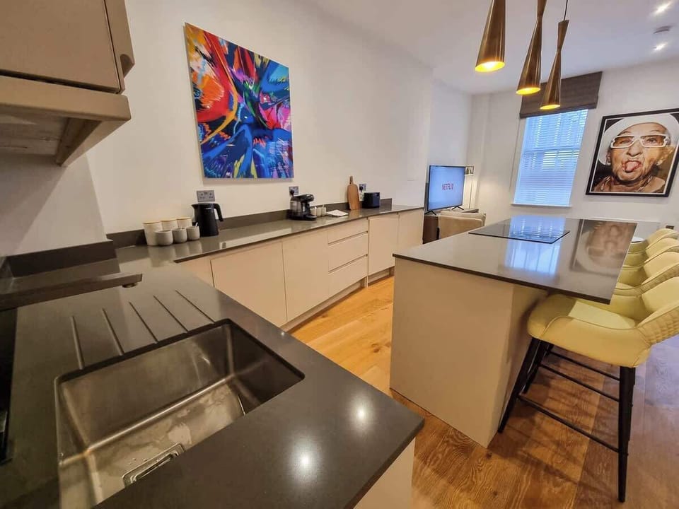 Breakfast bar seating for quick morning bites before heading out, or pull up a stool and enjoy a coffee from the complimentary Tassimo machine