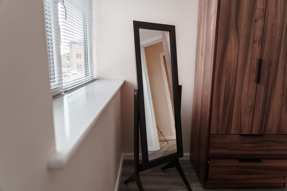 Start your day right with a full-length floor mirror, perfect for getting ready in style.