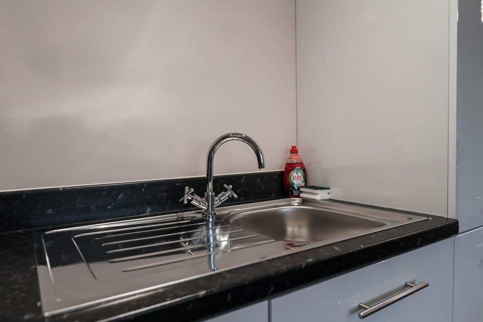 Enjoy the convenience of a fully equipped kitchen with ample counter space and modern touches.