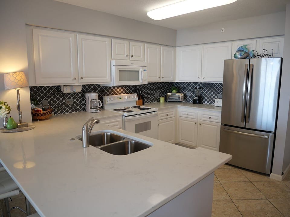 Condo, 2 Bedrooms | Private kitchen | Coffee/tea maker, fridge, oven, toaster