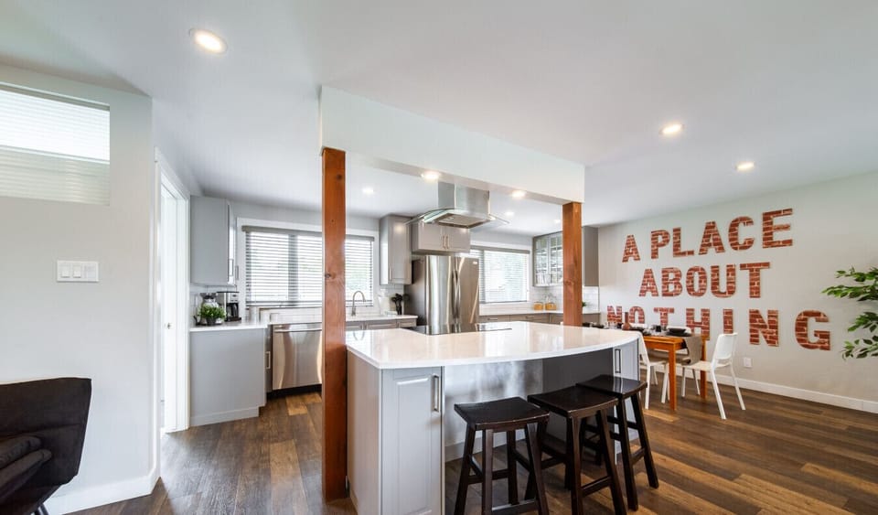 Cook and connect in the modern, fully equipped kitchen with island seating.