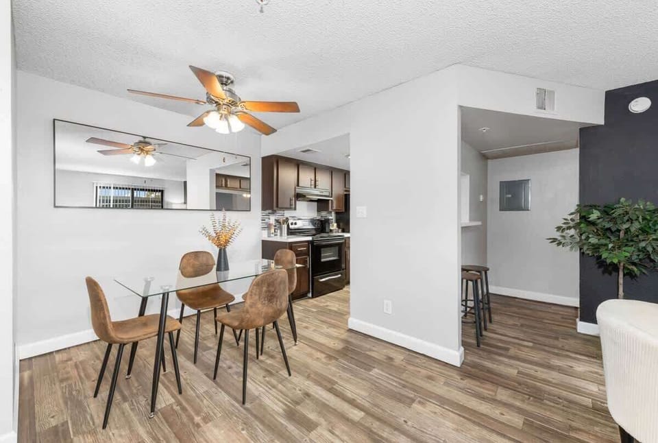 Elegant dining area with seating for four, plus a high chair for added convenience.