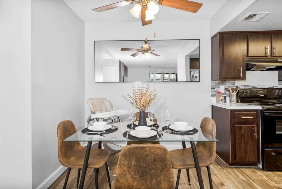 Elegant dining area with seating for four, plus a high chair for added convenience.