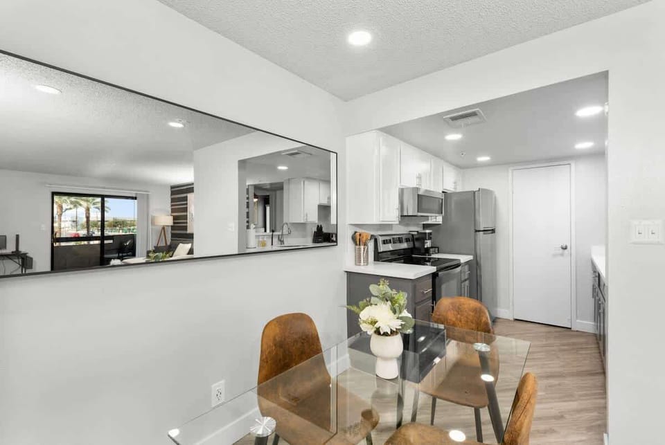 Elegant dining area with seating for four, plus a high chair for added convenience.