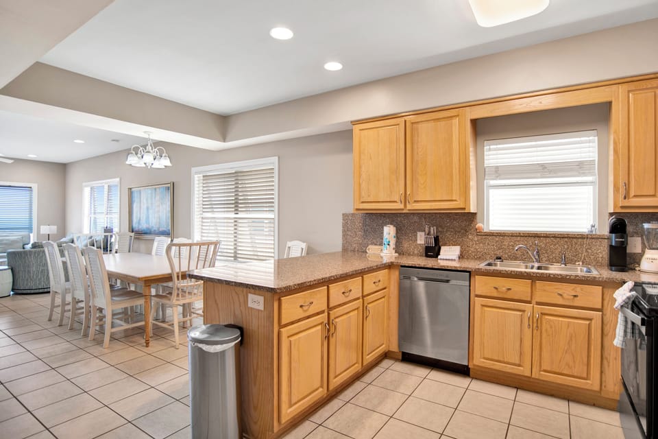 The kitchen has stainless appliances and granite counter tops