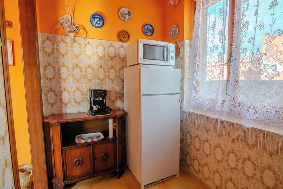 Apartment, Balcony | Private kitchen | Coffee/tea maker