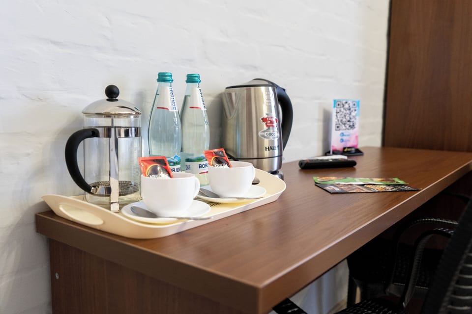 Deluxe Suite, City View | In-room safe, desk, laptop workspace, blackout drapes