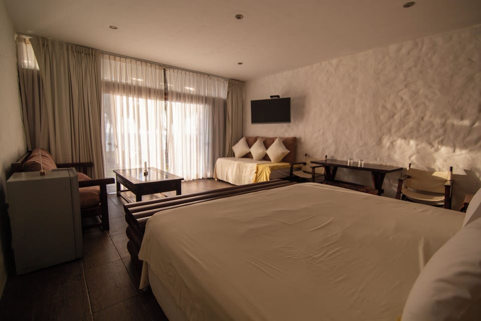 Suite, Balcony, Beach View | 1 bedroom, minibar, in-room safe, laptop workspace