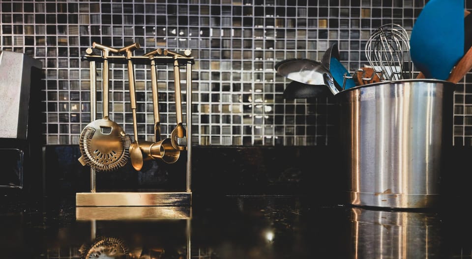 Sleek kitchen backsplash with modern cooking essentials