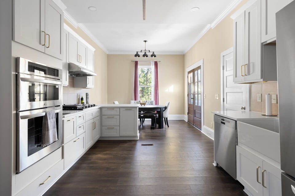 Spotless kitchen with sleek counters—ready for morning brews or big meals