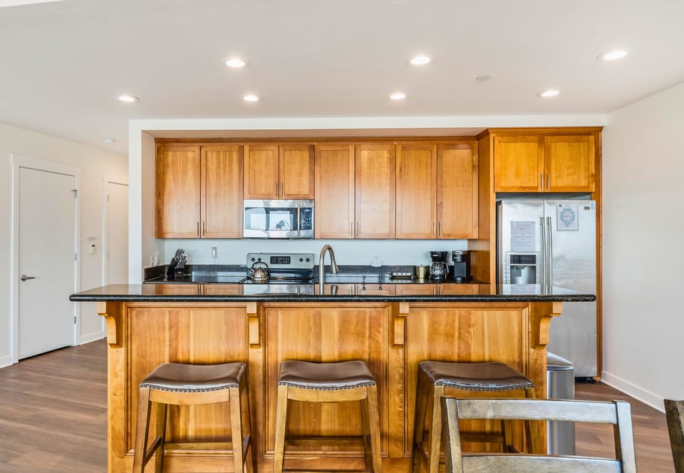 This kitchen with bar seating is perfect for cooking and making memories!