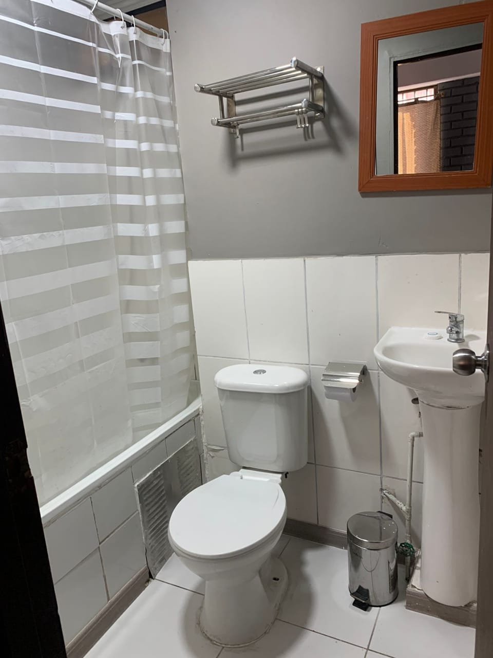 Bathtub, towels, soap, toilet paper