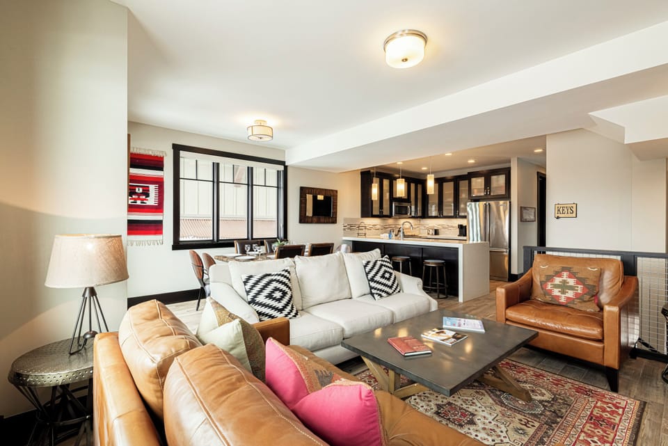 Living Room with Samsung smart tv, comfy furniture, gas fireplace, and small work area
